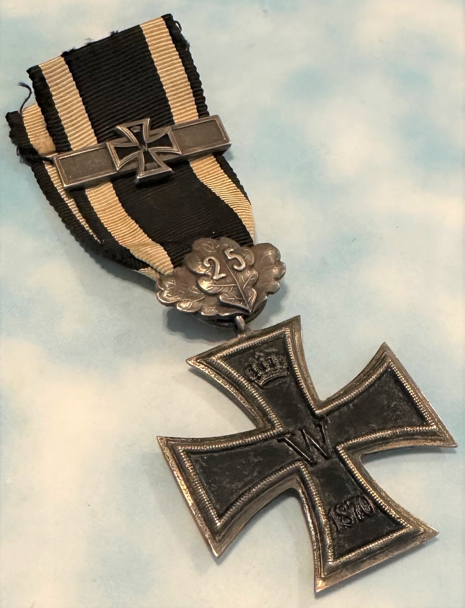 German 1870 Iron Cross 2nd class with 25 year oak leaves and 1914 Iron Cross 2nd class combination - Derrittmeister Militaria Group