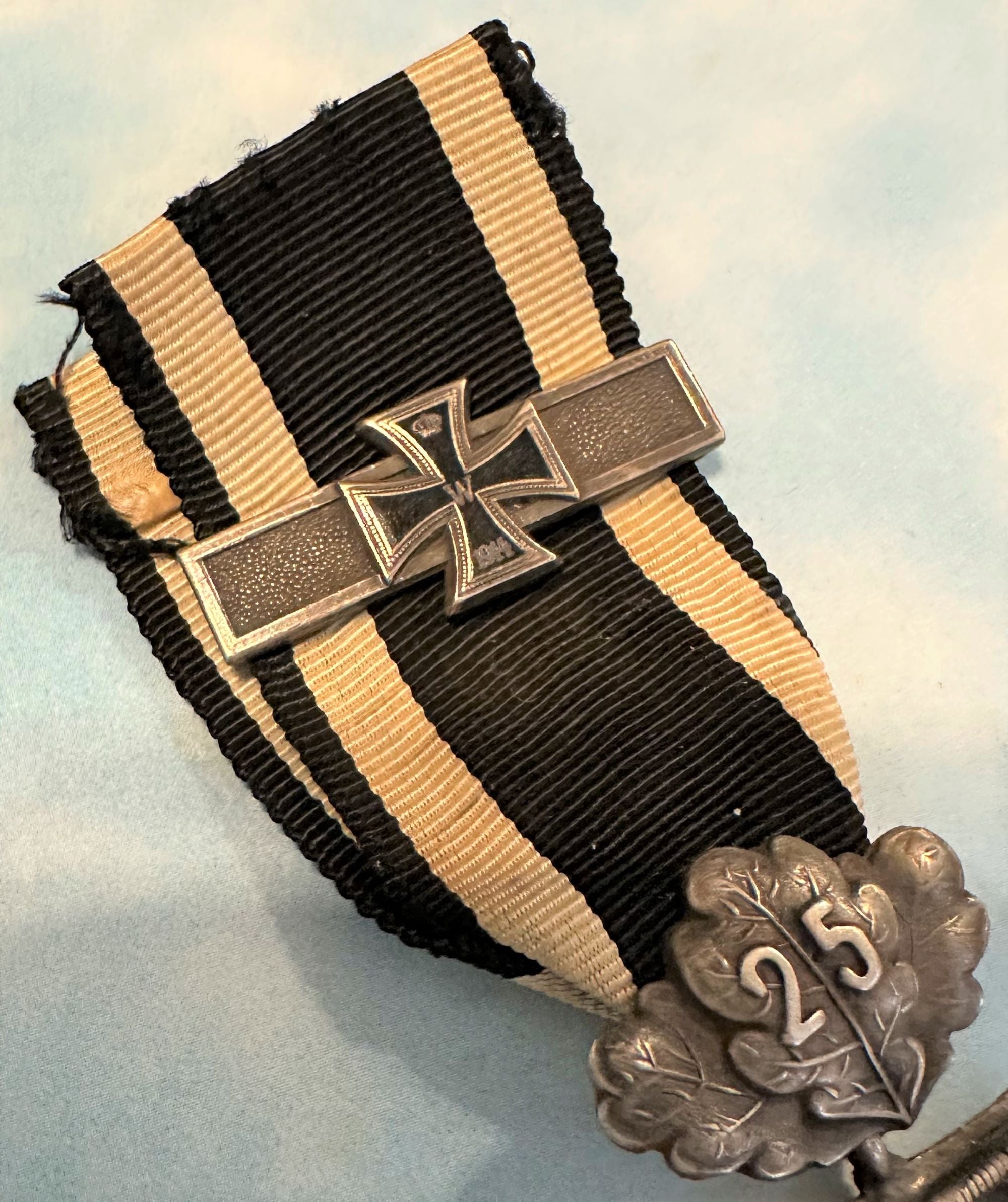 German 1870 Iron Cross 2nd class with 25 year oak leaves and 1914 Iron Cross 2nd class combination - Derrittmeister Militaria Group