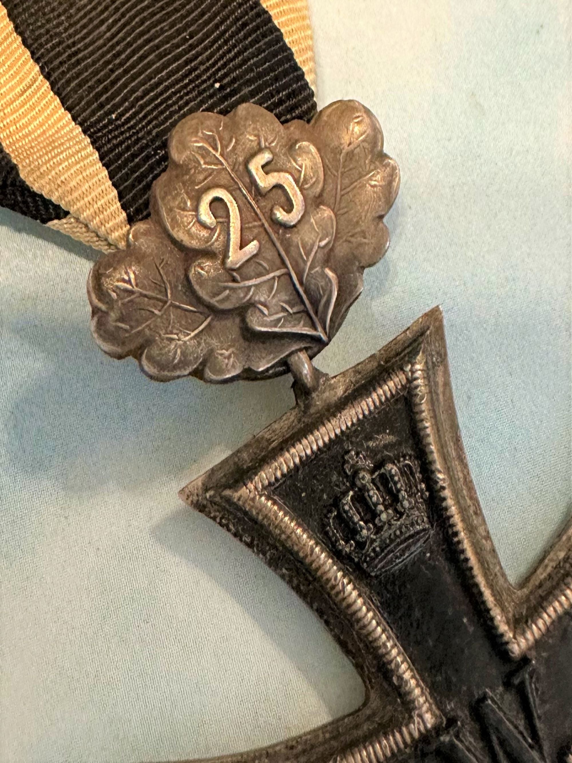 German 1870 Iron Cross 2nd class with 25 year oak leaves and 1914 Iron Cross 2nd class combination - Derrittmeister Militaria Group