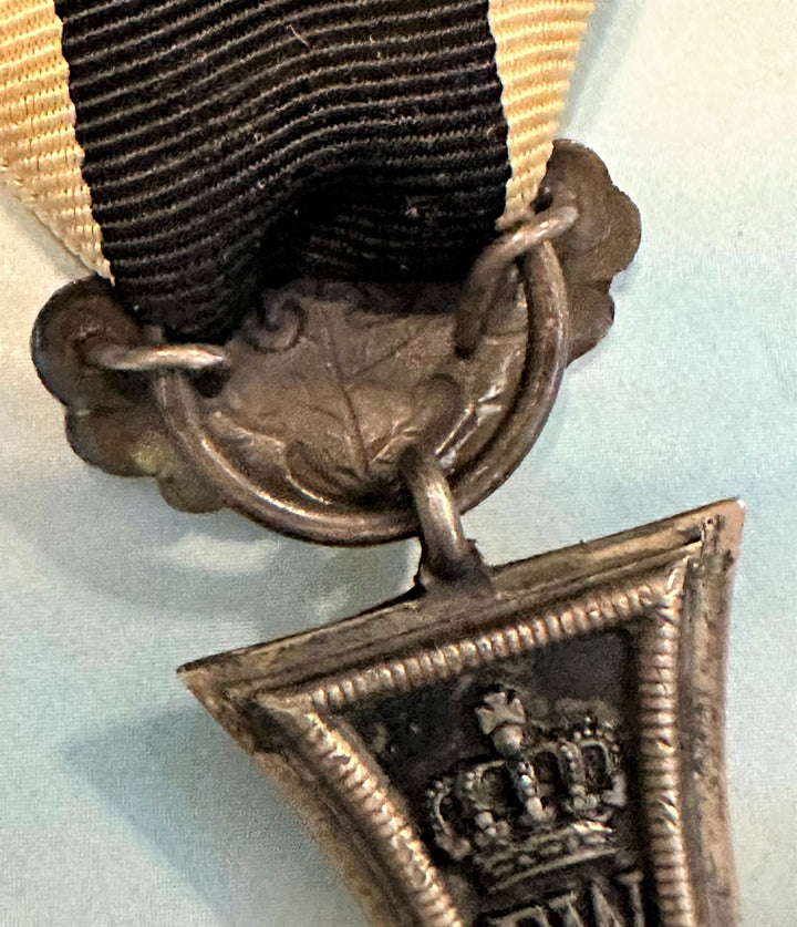 German 1870 Iron Cross 2nd class with 25 year oak leaves and 1914 Iron Cross 2nd class combination - Derrittmeister Militaria Group