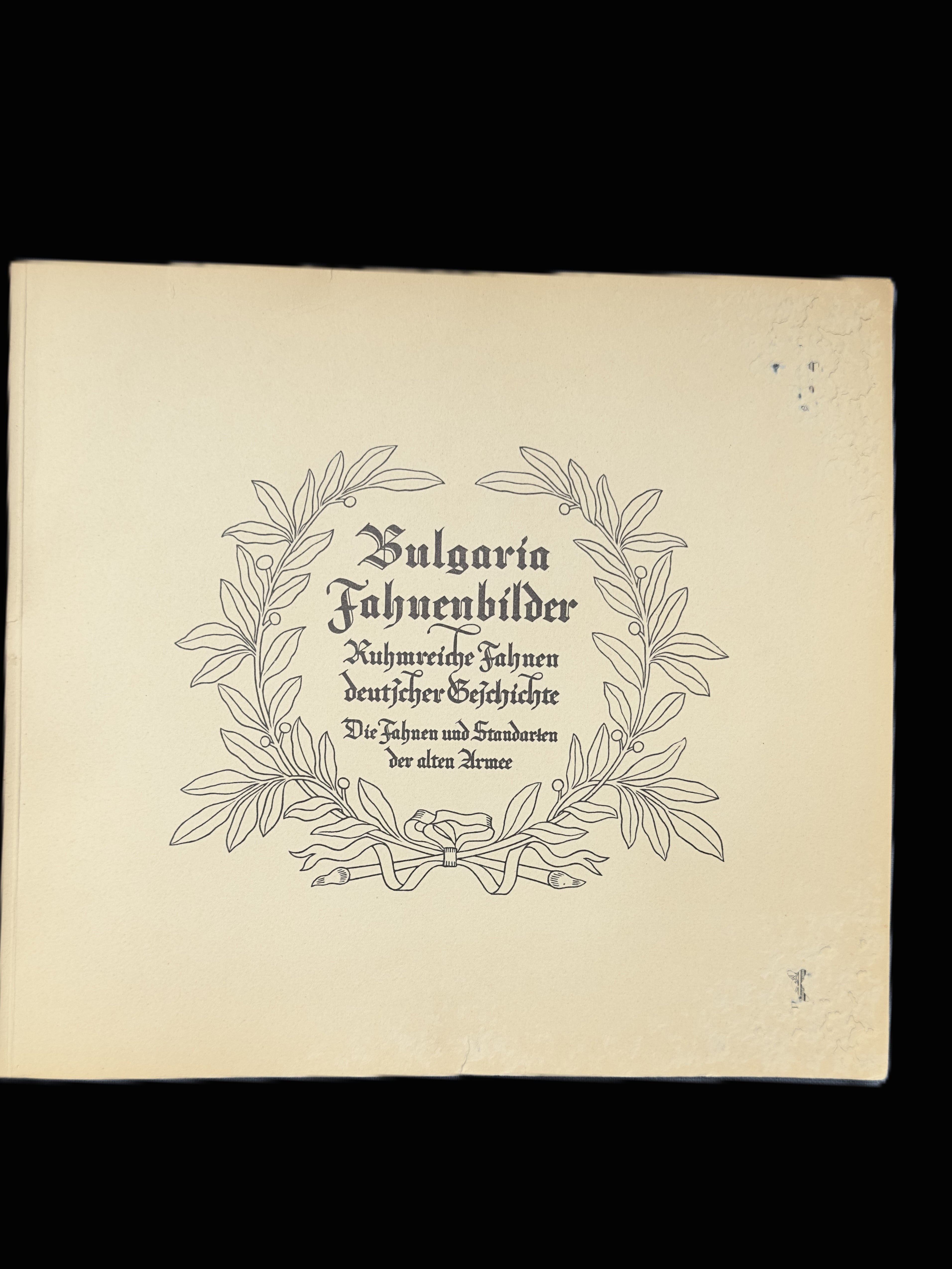 A square cream-colored paper cover or booklet with black printed text in German reading 'Bulgaria Fahrenbilder' surrounded by a decorative wreath illustration, shown against a black background.
