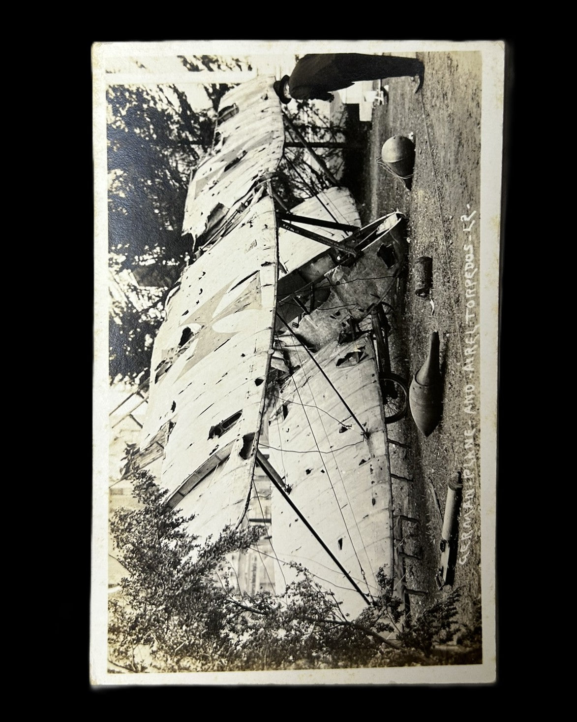 WWI German Damaged Biplane and Aerial Torpedoes Real Photo Postcard